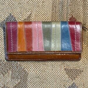 Fossil leather wallet with multiple pockets and one internal zippered packets